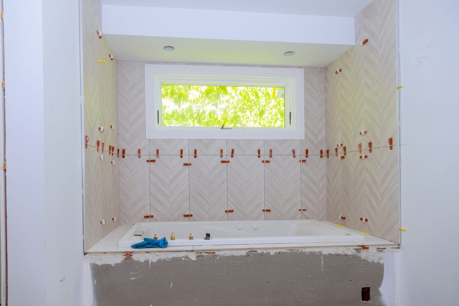 Laying tile, trowel in a preparation for laying tile.