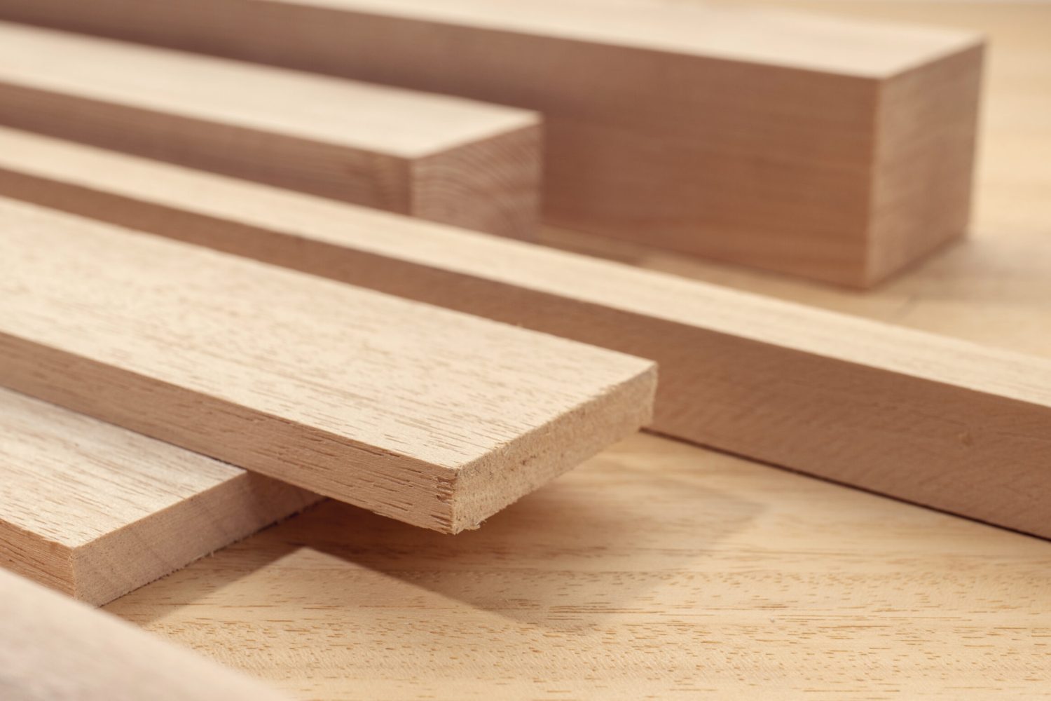 Group of assorted wood material like planks, squares, sheets. Timber for carpentry. Close up